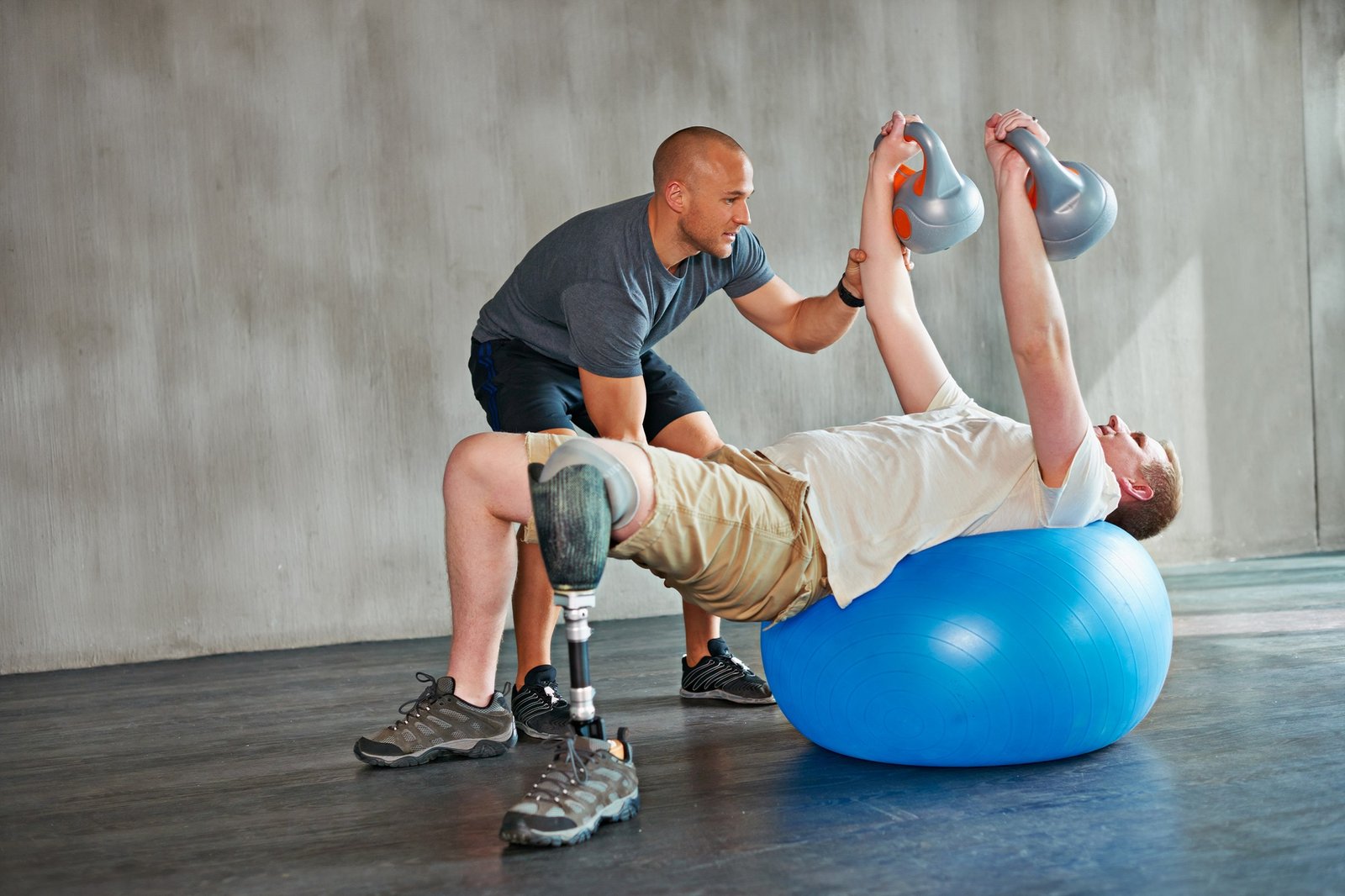 Focus on the upper body. Studio shot of a young amputee training